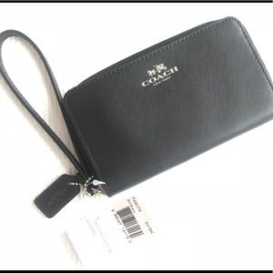 Brand new black coach wristlet in box.